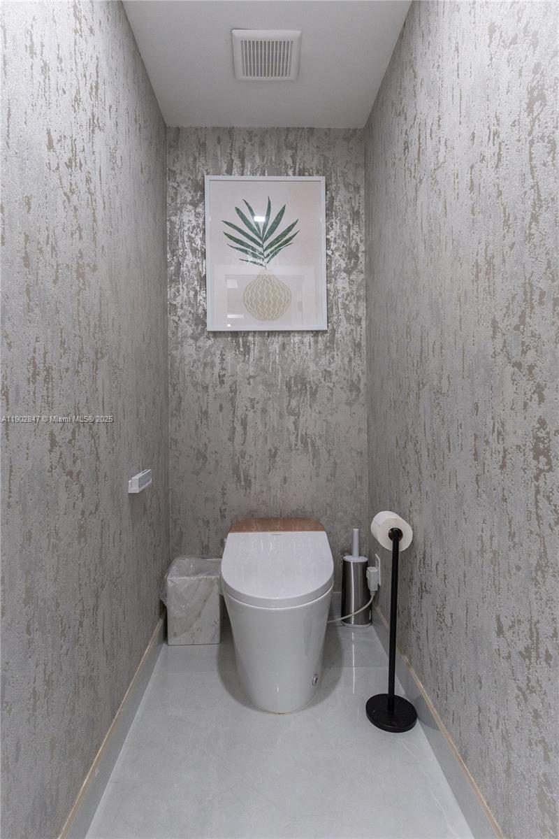 5601 North Ocean Drive Hollywood, FL 33019 - Photo 53 of 78 a bathroom with a toilet and a sink