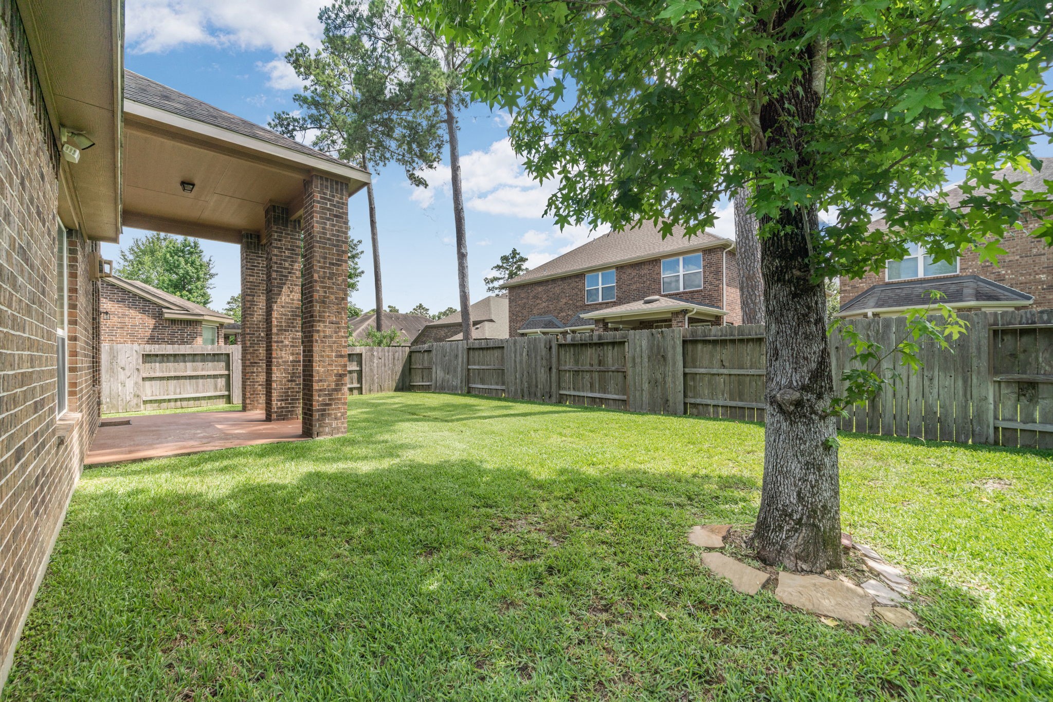 22523 Birch Ridge Meadow Drive Spring, TX 77389 - Photo 33 of 39 a view of a back yard with a trees