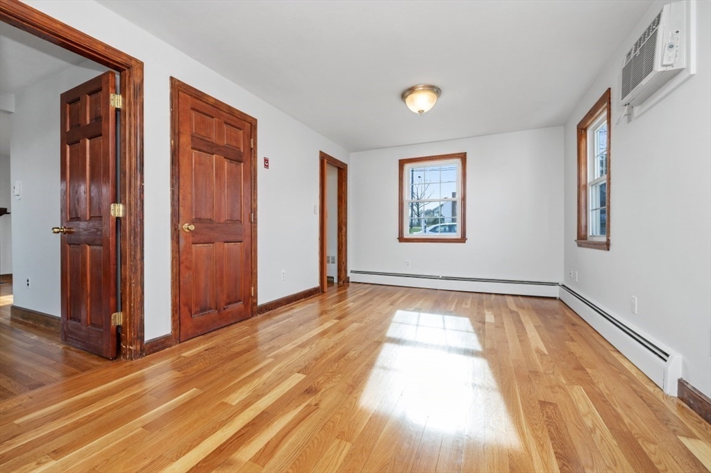 15 Shawmut Road Waltham, MA 02452 - Photo 13 of 40 wooden floor in an empty room with a window
