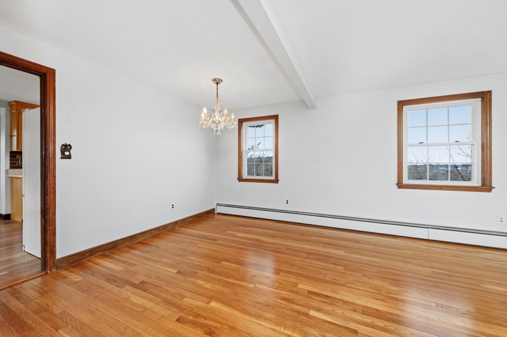 15 Shawmut Road Waltham, MA 02452 - Photo 14 of 40 a view of an empty room with window and wooden floor