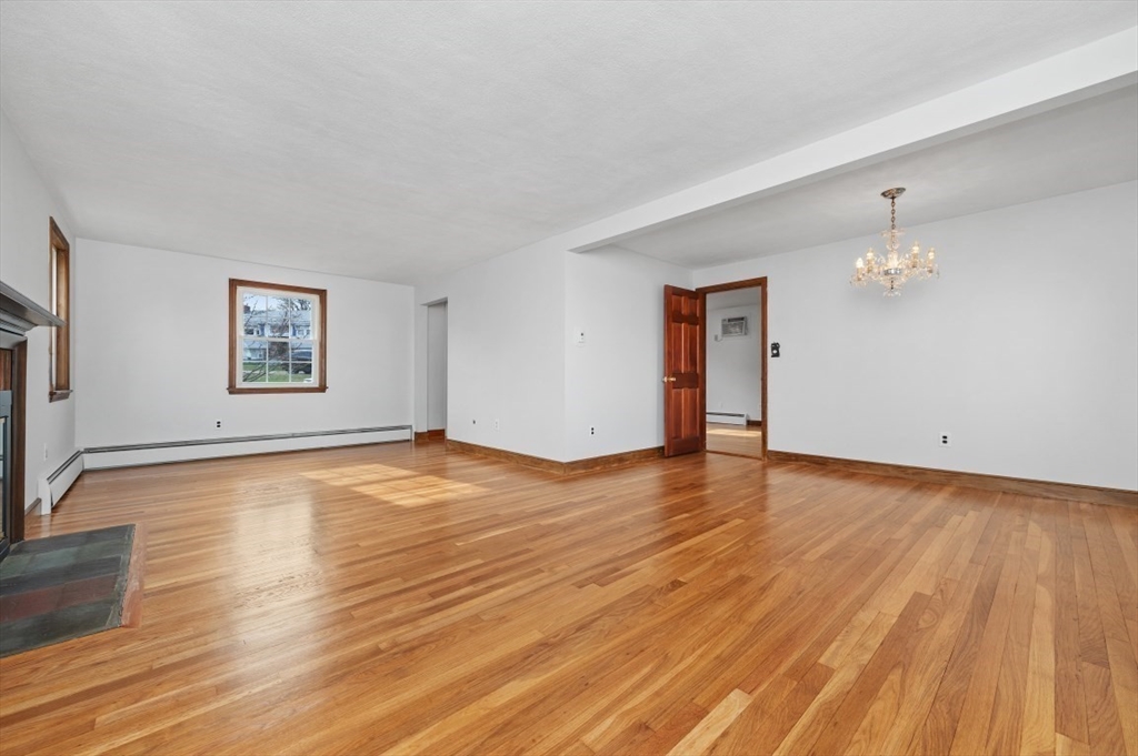 15 Shawmut Road Waltham, MA 02452 - Photo 16 of 40 a view of empty room with wooden floor and fan