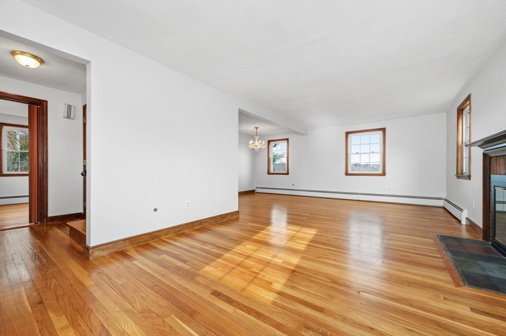 15 Shawmut Road Waltham, MA 02452 - Photo 17 of 40 an empty room with wooden floor and windows