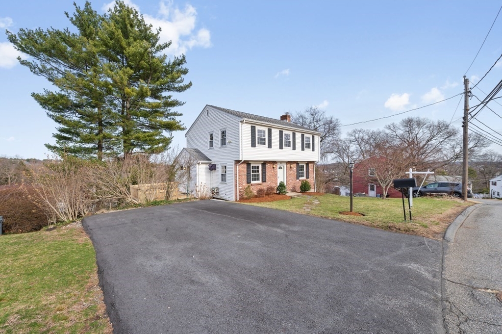 15 Shawmut Road Waltham, MA 02452 - Photo 2 of 40 a view of a house with a yard and a basketball court