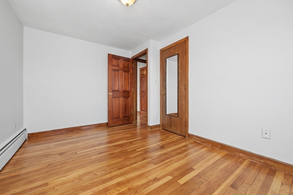 15 Shawmut Road Waltham, MA 02452 - Photo 27 of 40 a view of an empty room with wooden floor
