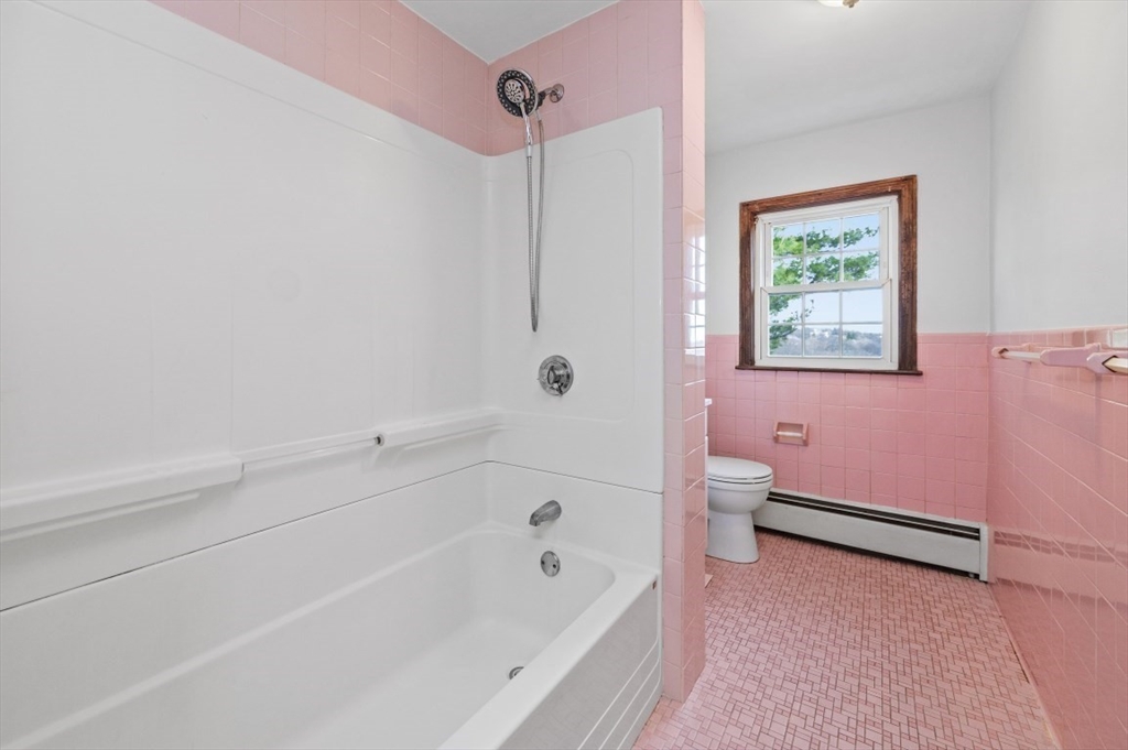 15 Shawmut Road Waltham, MA 02452 - Photo 31 of 40 a bathroom with a bathtub and shower
