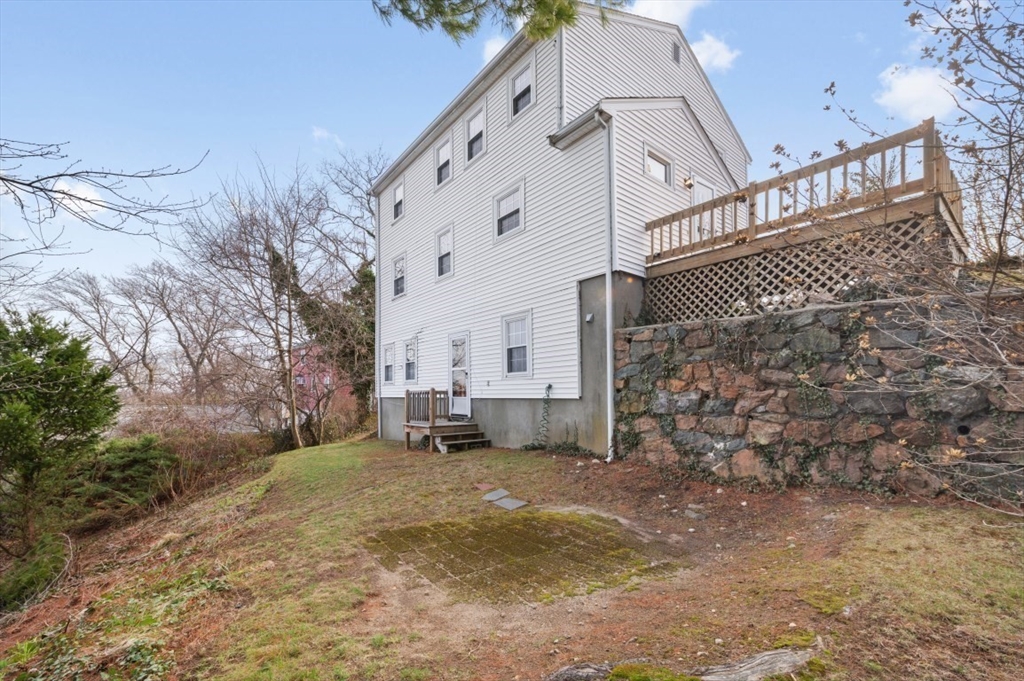 15 Shawmut Road Waltham, MA 02452 - Photo 39 of 40 a view of a house with a yard in the background