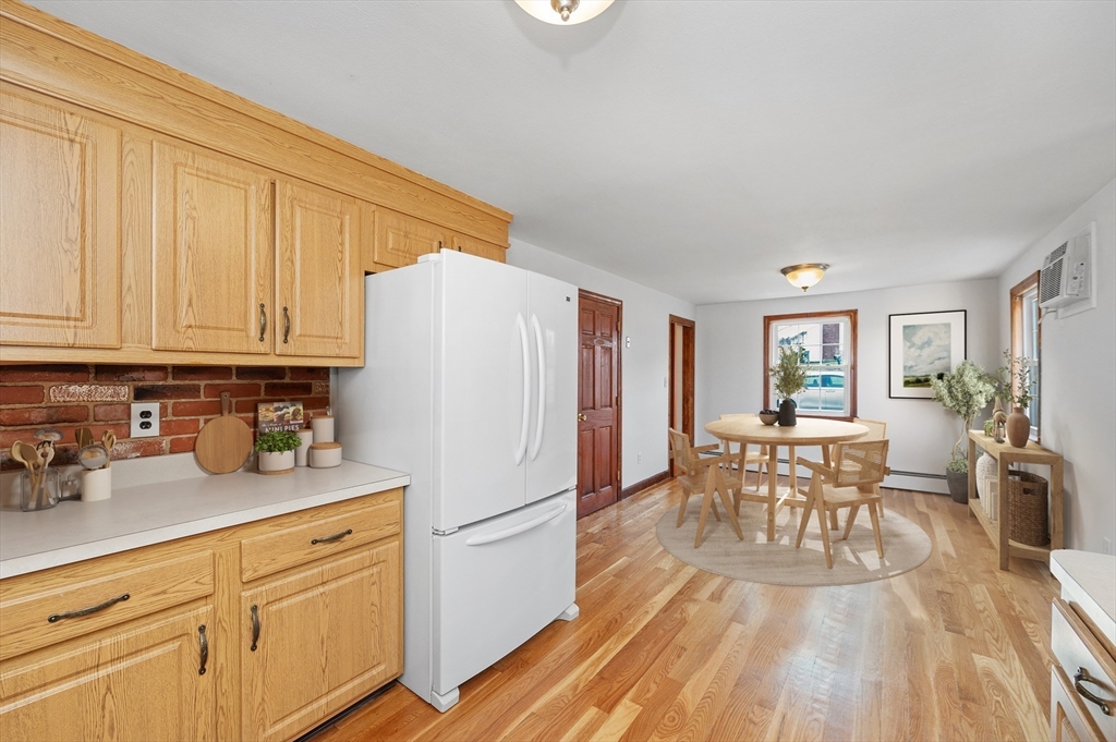 15 Shawmut Road Waltham, MA 02452 - Photo 6 of 40 a kitchen with granite countertop appliances cabinets and furniture