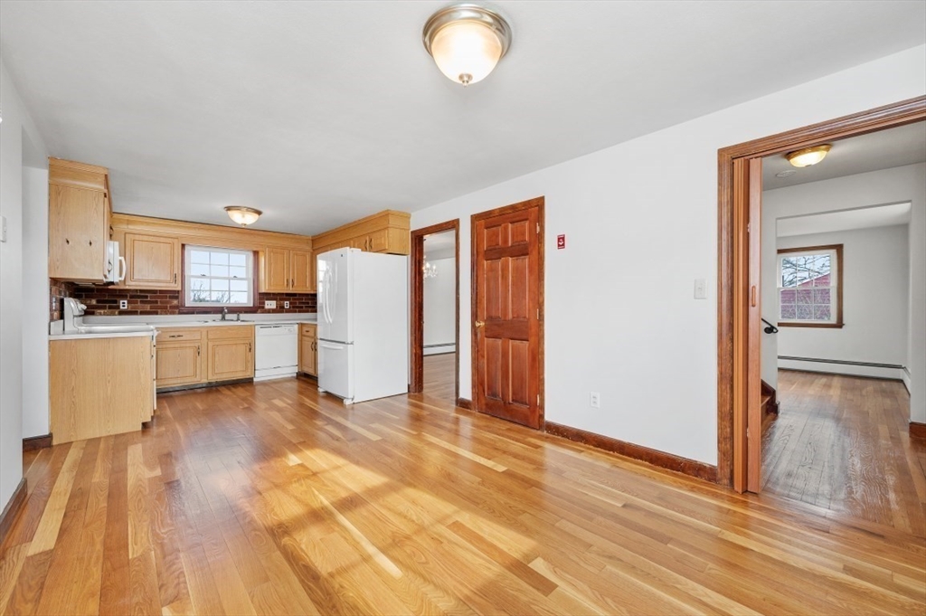 15 Shawmut Road Waltham, MA 02452 - Photo 7 of 40 a view of a kitchen with wooden floor and a sink