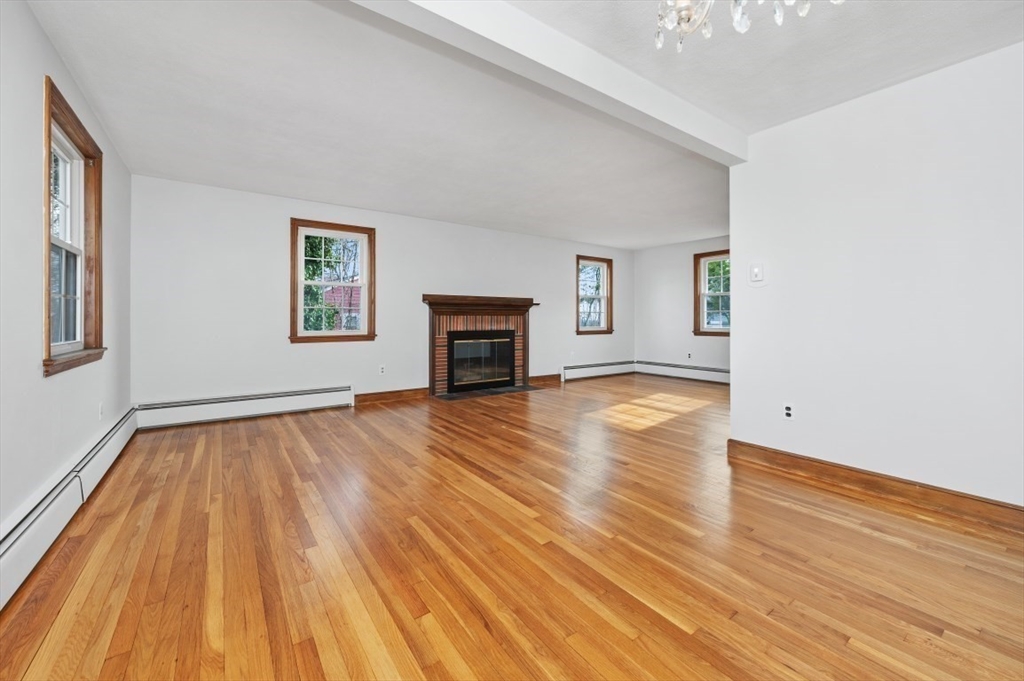 15 Shawmut Road Waltham, MA 02452 - Photo 8 of 40 a view of empty room with wooden floor and fan