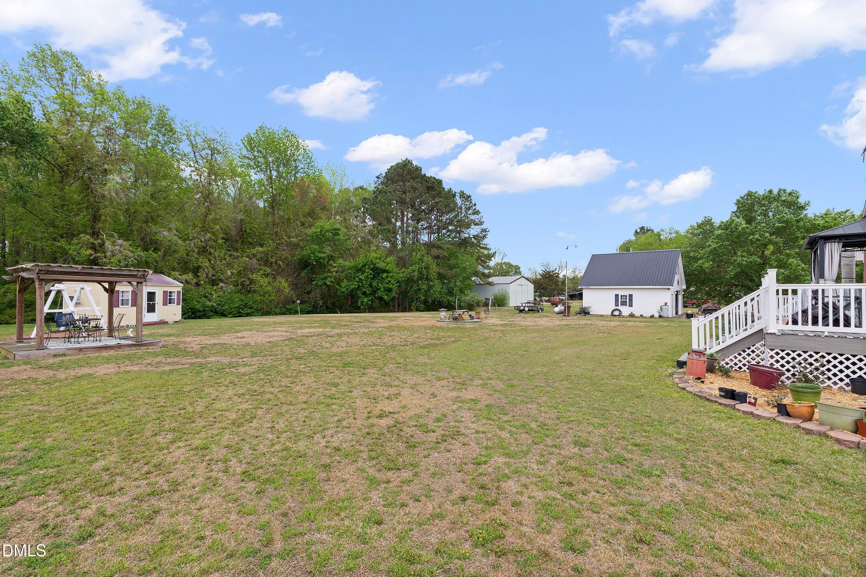 6314 Old Davis Road Sims, NC 27880 - Photo 56 of 71 a view of a house with a yard
