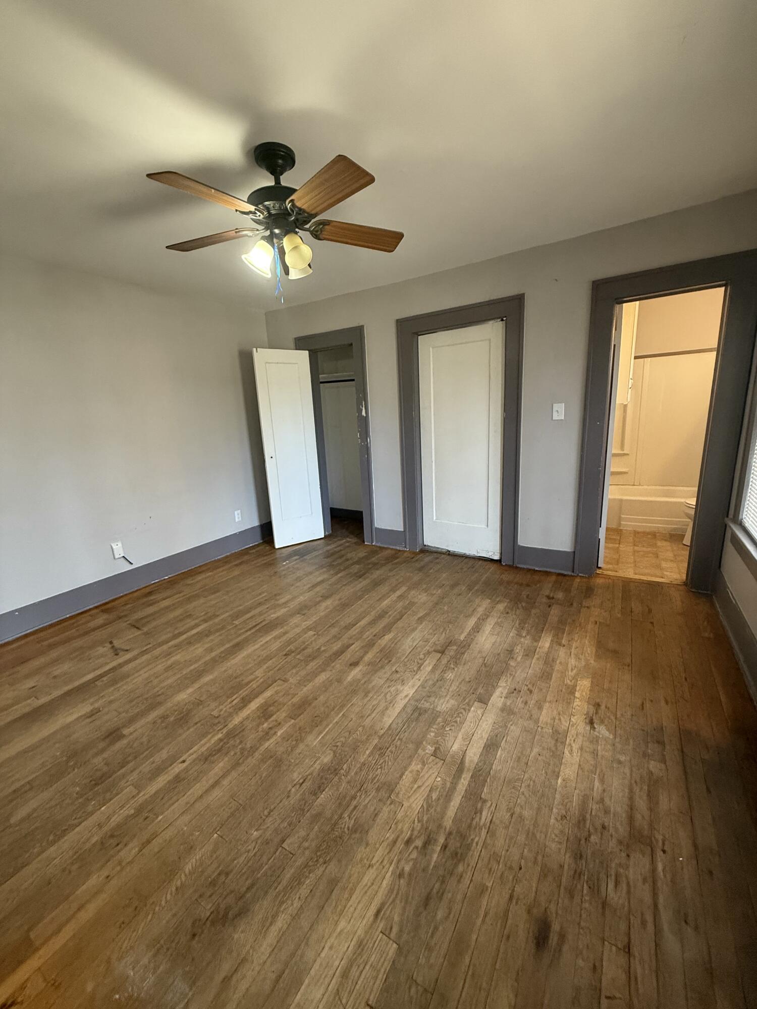Package Package Property Lubbock, TX 79411 - Photo 68 of 71 a view of an empty room with wooden floor and a window