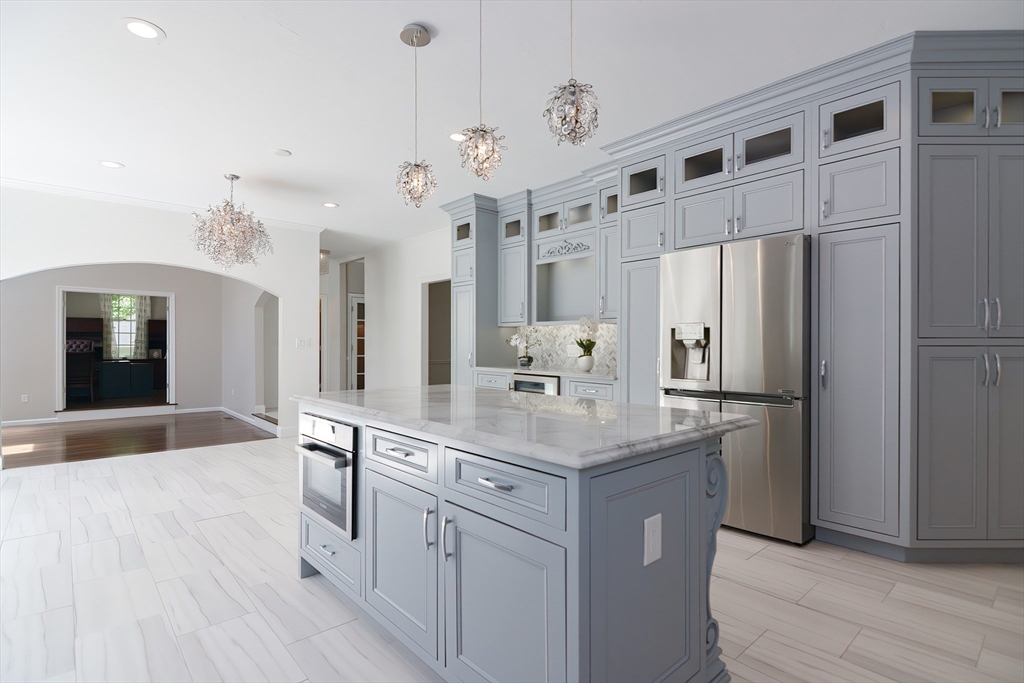 23 Newell Drive Franklin, MA 02038 - Photo 12 of 35 a kitchen with stainless steel appliances a refrigerator sink and cabinets