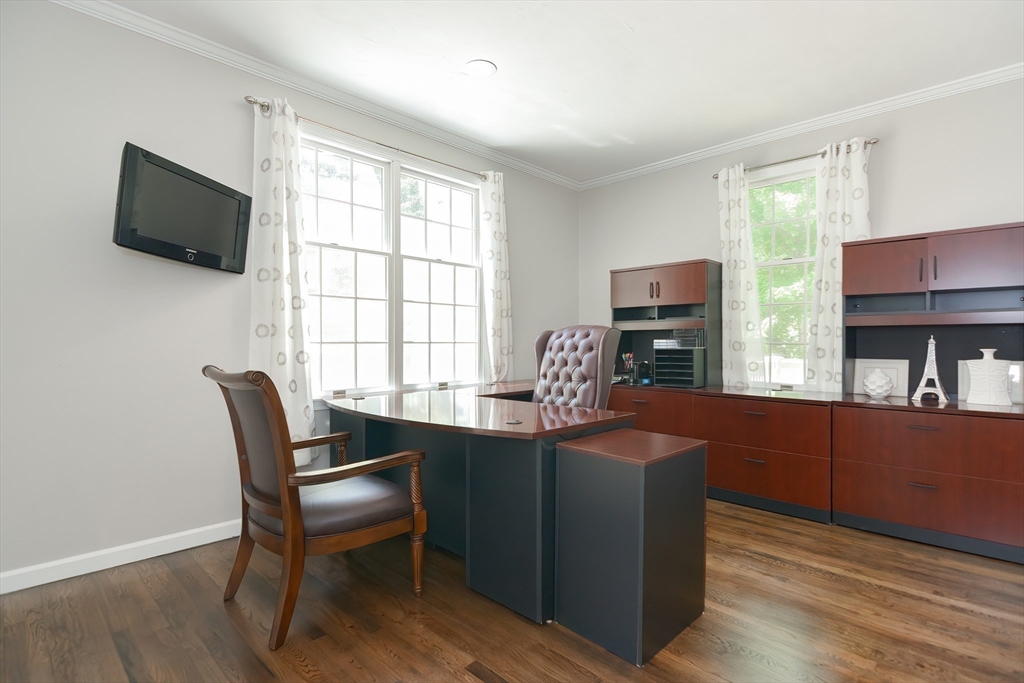 23 Newell Drive Franklin, MA 02038 - Photo 17 of 35 a dining room with furniture a window and a flat screen tv