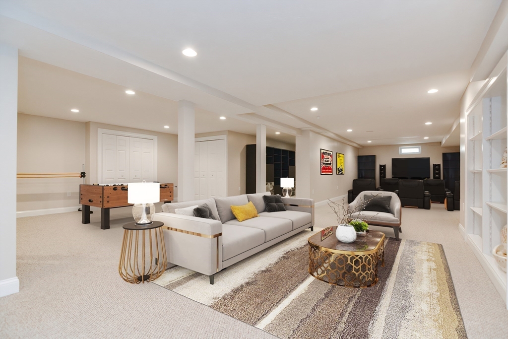 23 Newell Drive Franklin, MA 02038 - Photo 27 of 35 a living room with furniture and a table