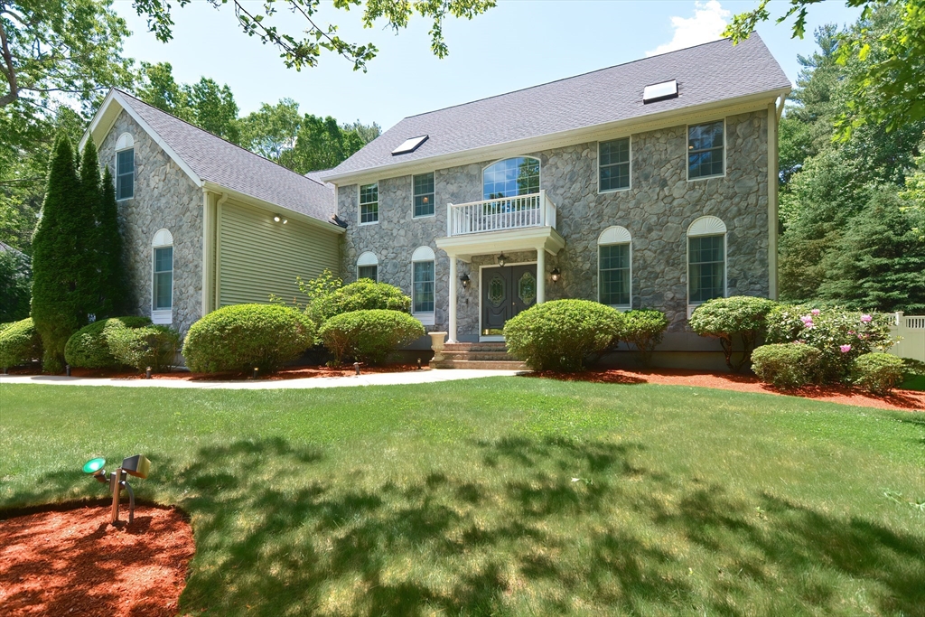 23 Newell Drive Franklin, MA 02038 - Photo 3 of 35 a view of a house with backyard and garden