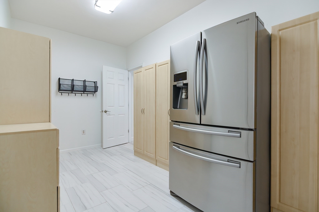 23 Newell Drive Franklin, MA 02038 - Photo 31 of 35 a kitchen with stainless steel appliances a refrigerator and a stove top oven