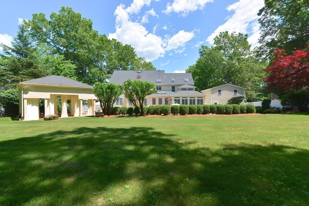23 Newell Drive Franklin, MA 02038 - Photo 35 of 35 a front view of a house with a garden