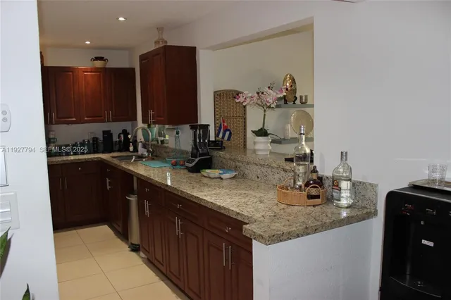 a view of a dining room with furniture and window