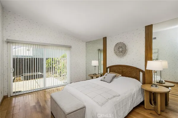 a bedroom with a bed and a table