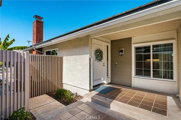 a front view of a house with a rug