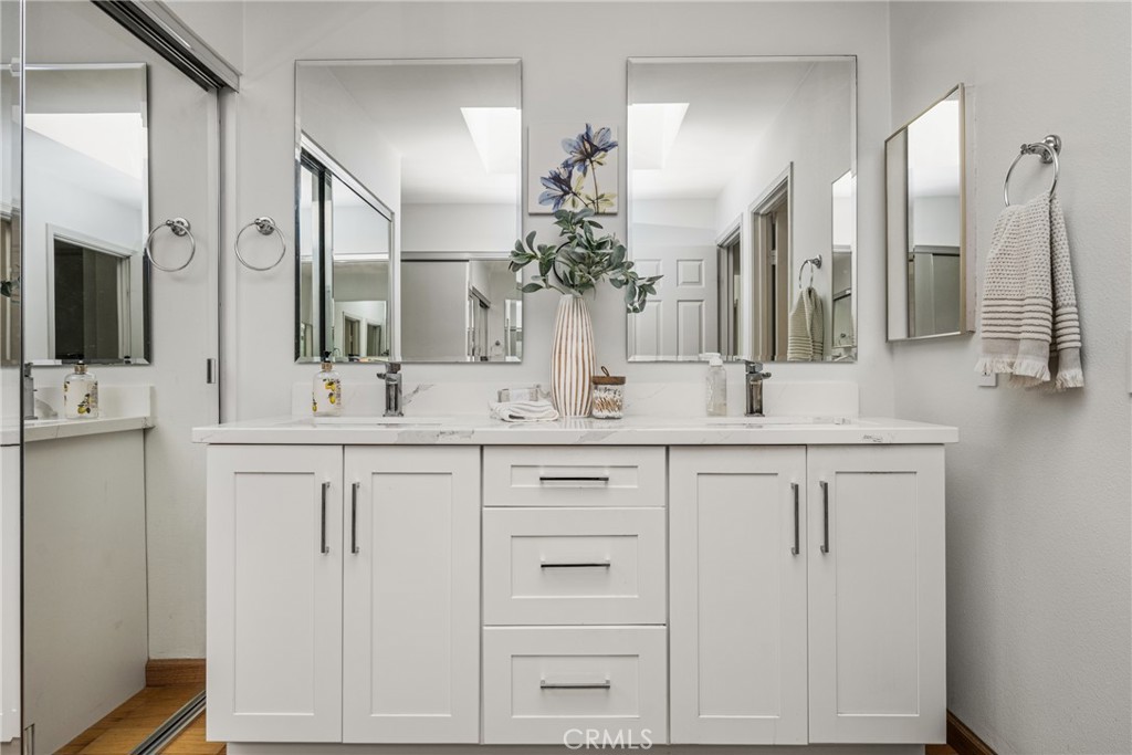 6 Whitecloud Irvine, CA 92614 - Photo 21 of 45 a bathroom with double vanity and a mirror