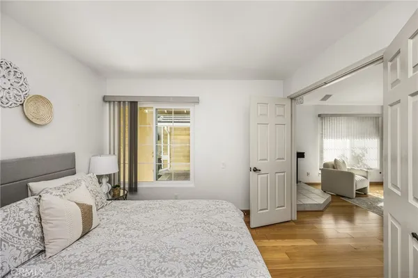 a bedroom with a bed and window