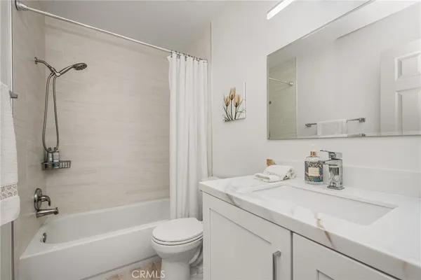 a bathroom with a sink a toilet and a bathtub