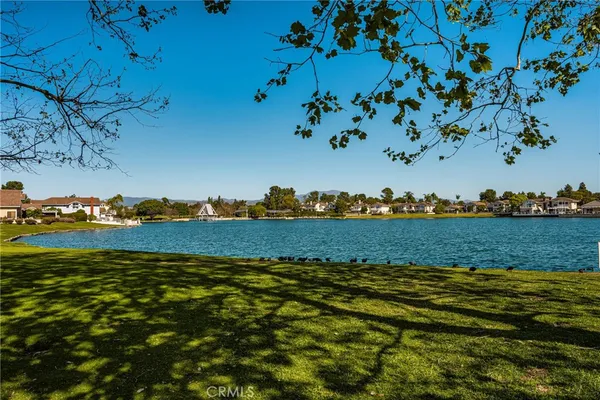 an aerial view of a residential houses with outdoor space