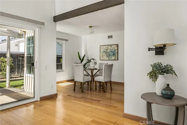 a view of a livingroom with furniture and a potted plant