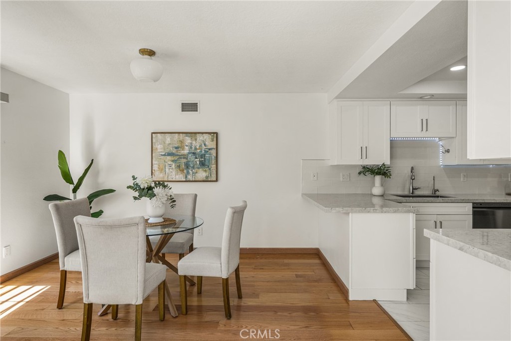 6 Whitecloud Irvine, CA 92614 - Photo 8 of 45 a view of a dining room with furniture and wooden floor
