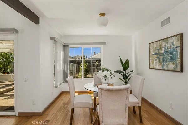 a white table sitting in a living room next to a window