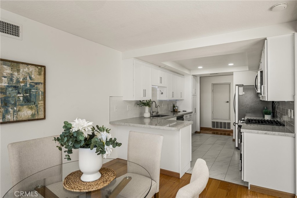 6 Whitecloud Irvine, CA 92614 - Photo 10 of 45 a kitchen with a refrigerator and a chair
