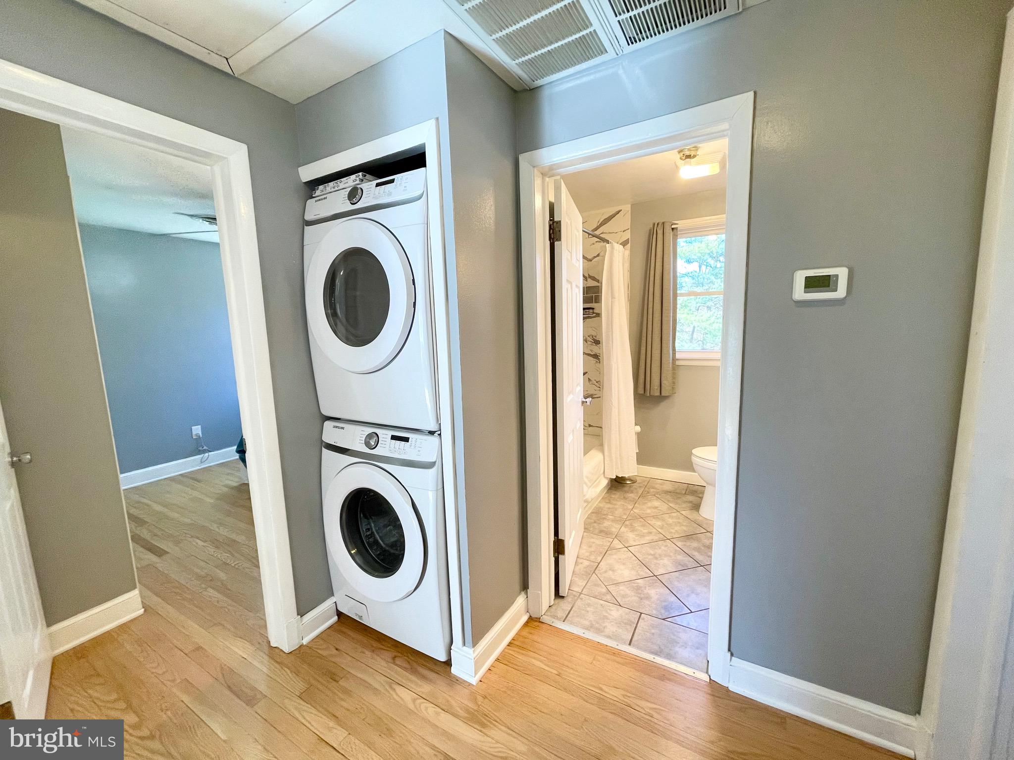 28321 Kemptown Road Damascus, MD 20872 - Photo 11 of 57 a view of a bedroom with washer and dryer