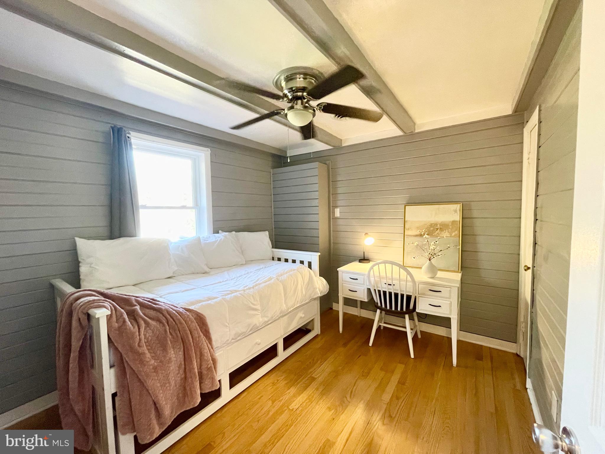 28321 Kemptown Road Damascus, MD 20872 - Photo 14 of 57 a bedroom with a bed and a chandelier