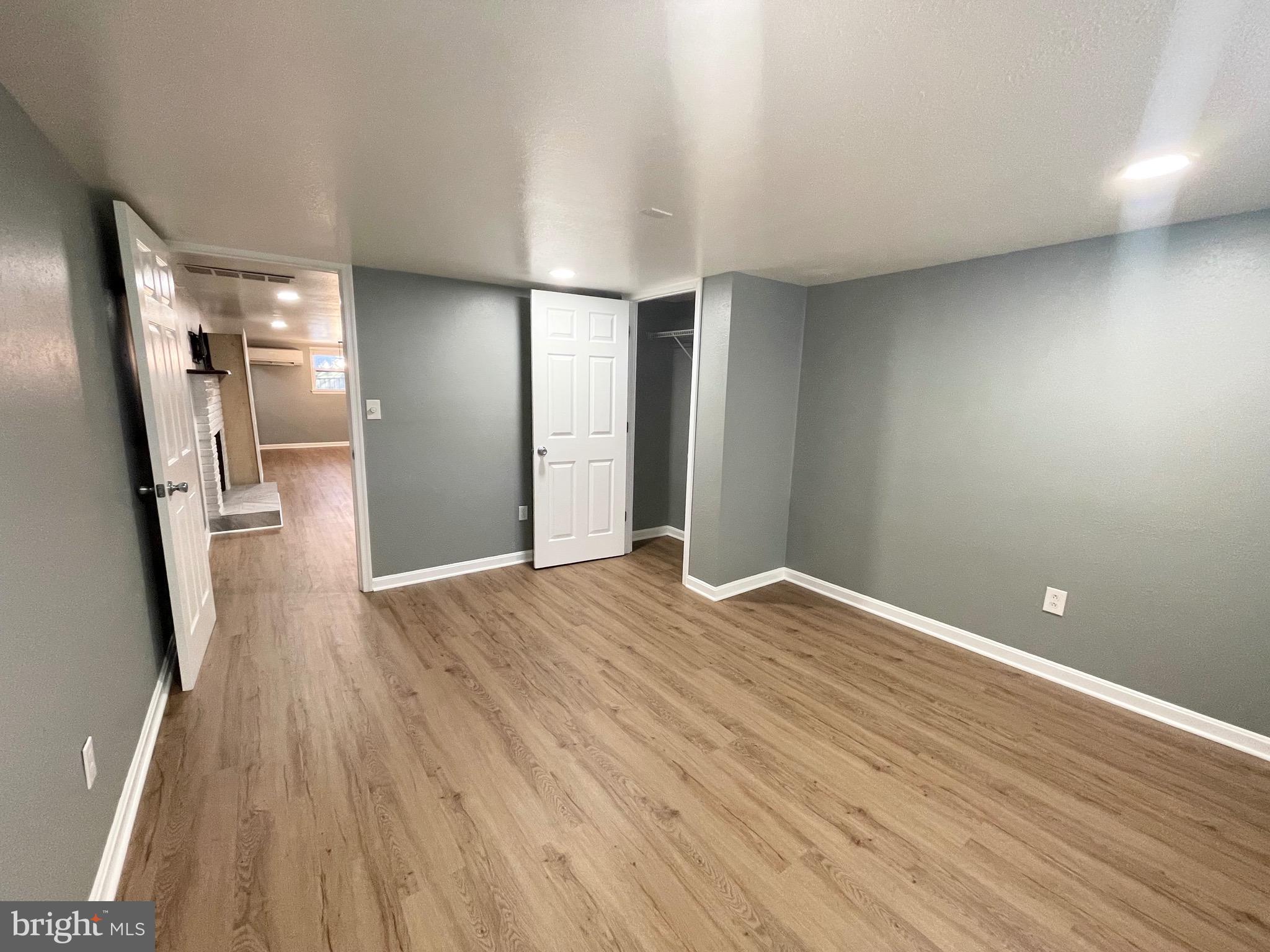 28321 Kemptown Road Damascus, MD 20872 - Photo 24 of 57 a view of empty room with wooden floor