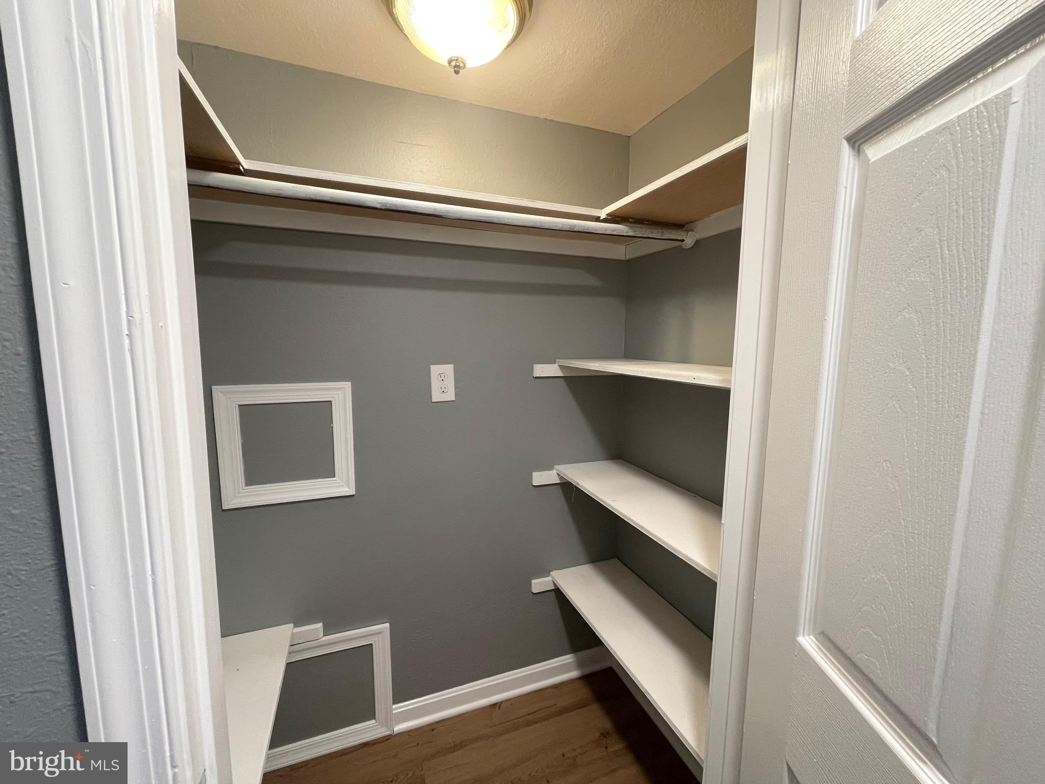28321 Kemptown Road Damascus, MD 20872 - Photo 26 of 57 a view of storage and utility room with wooden floor