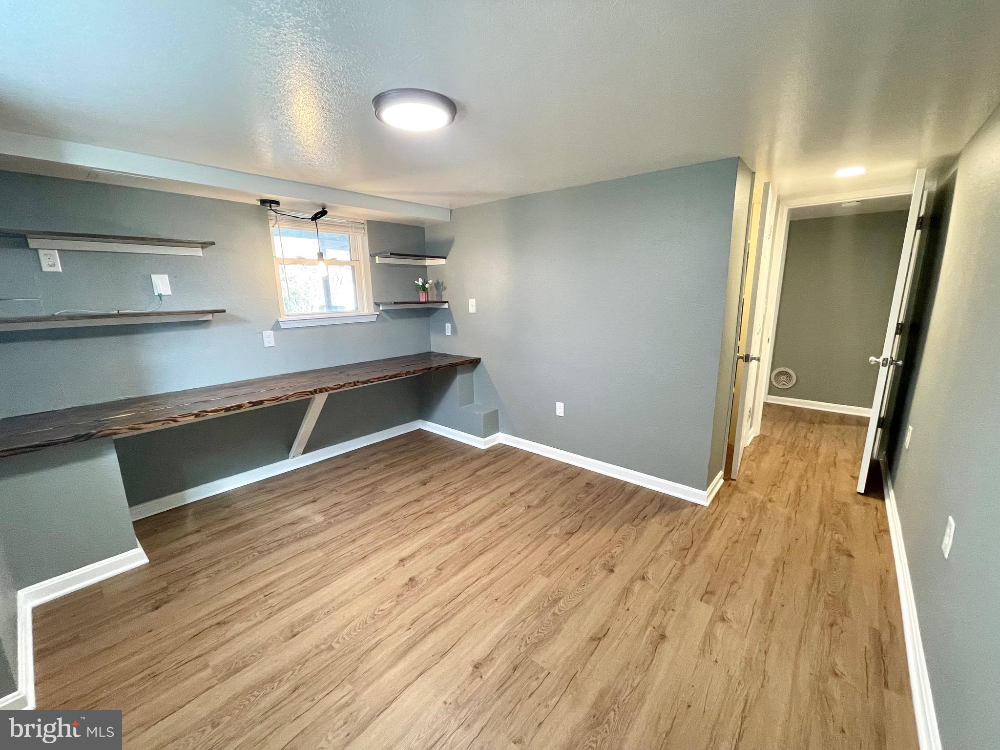 28321 Kemptown Road Damascus, MD 20872 - Photo 27 of 57 a view of a room with wooden floor and staircase