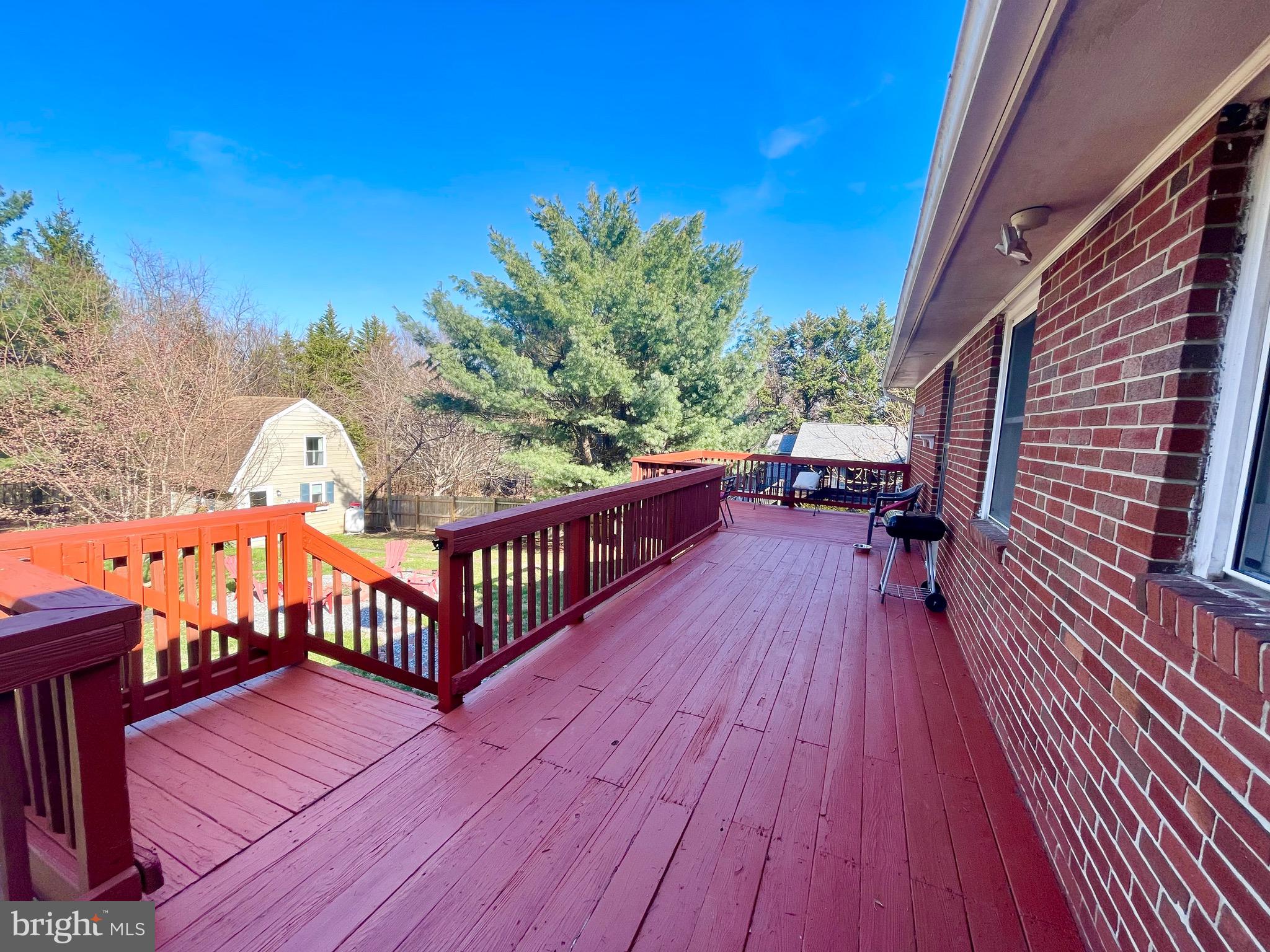 28321 Kemptown Road Damascus, MD 20872 - Photo 33 of 57 a view of balcony with wooden floor and outdoor seating