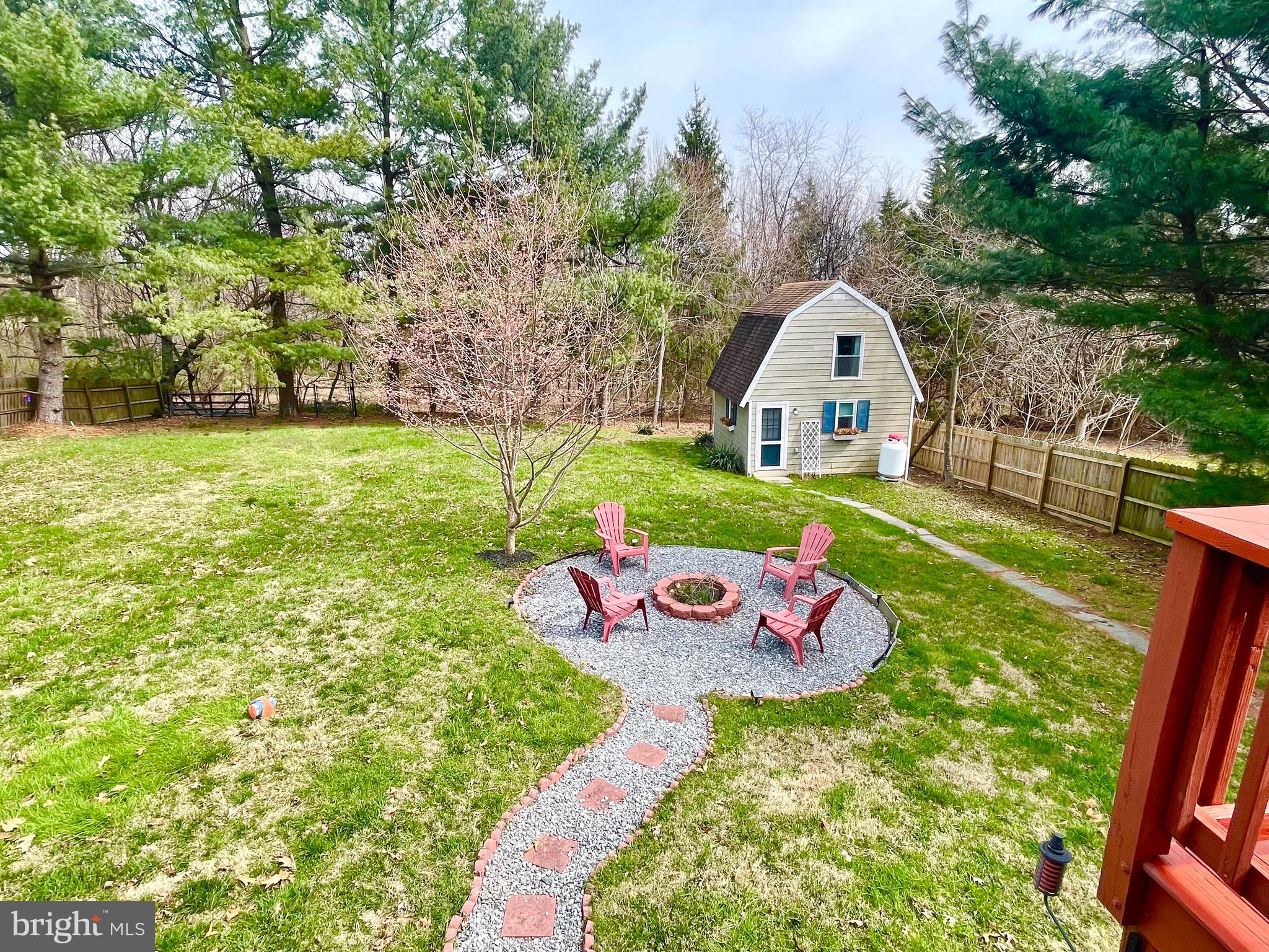 28321 Kemptown Road Damascus, MD 20872 - Photo 39 of 57 a view of a backyard with table and chairs and potted plants