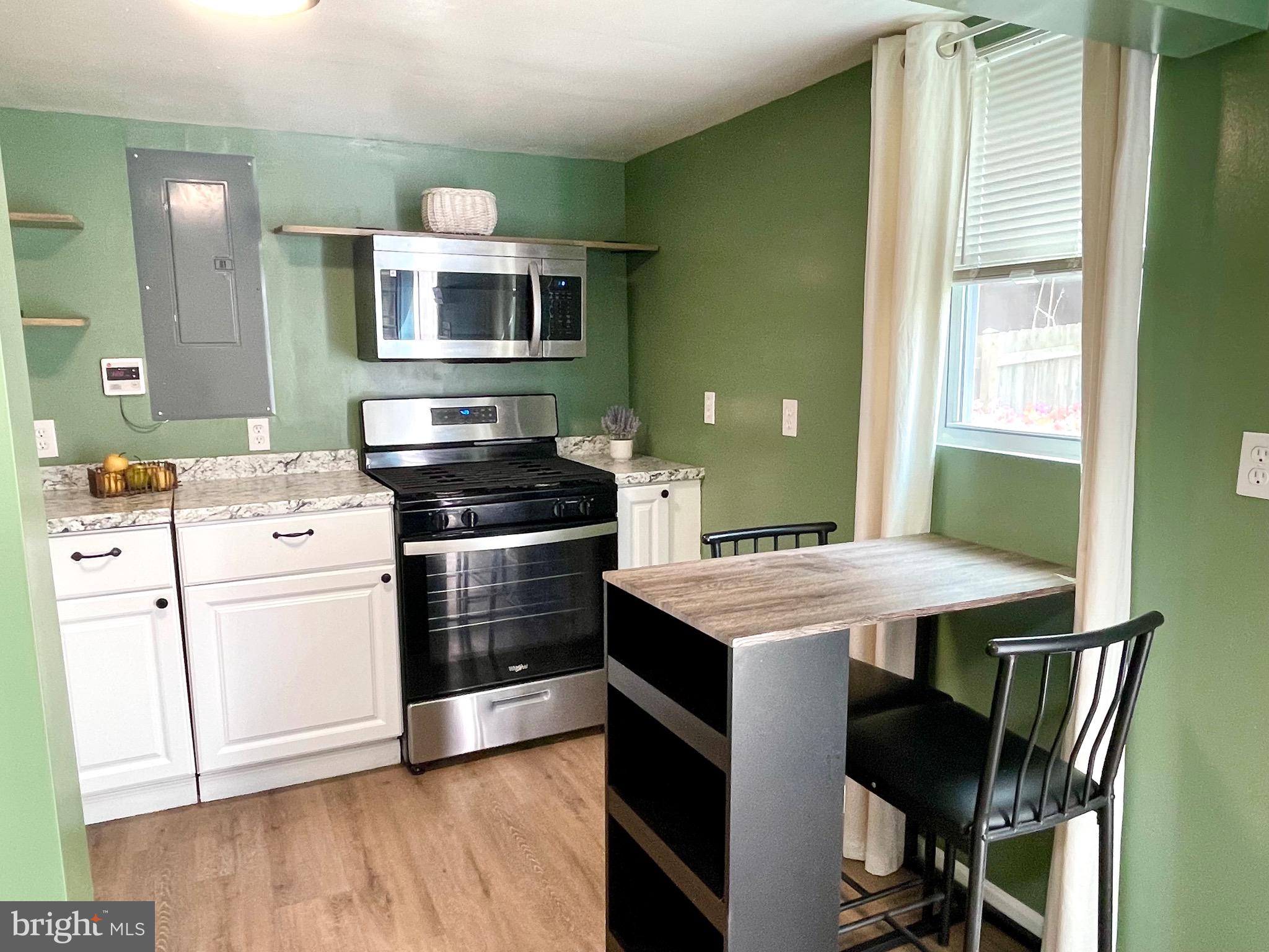 28321 Kemptown Road Damascus, MD 20872 - Photo 44 of 57 a kitchen that has a table and chair in it