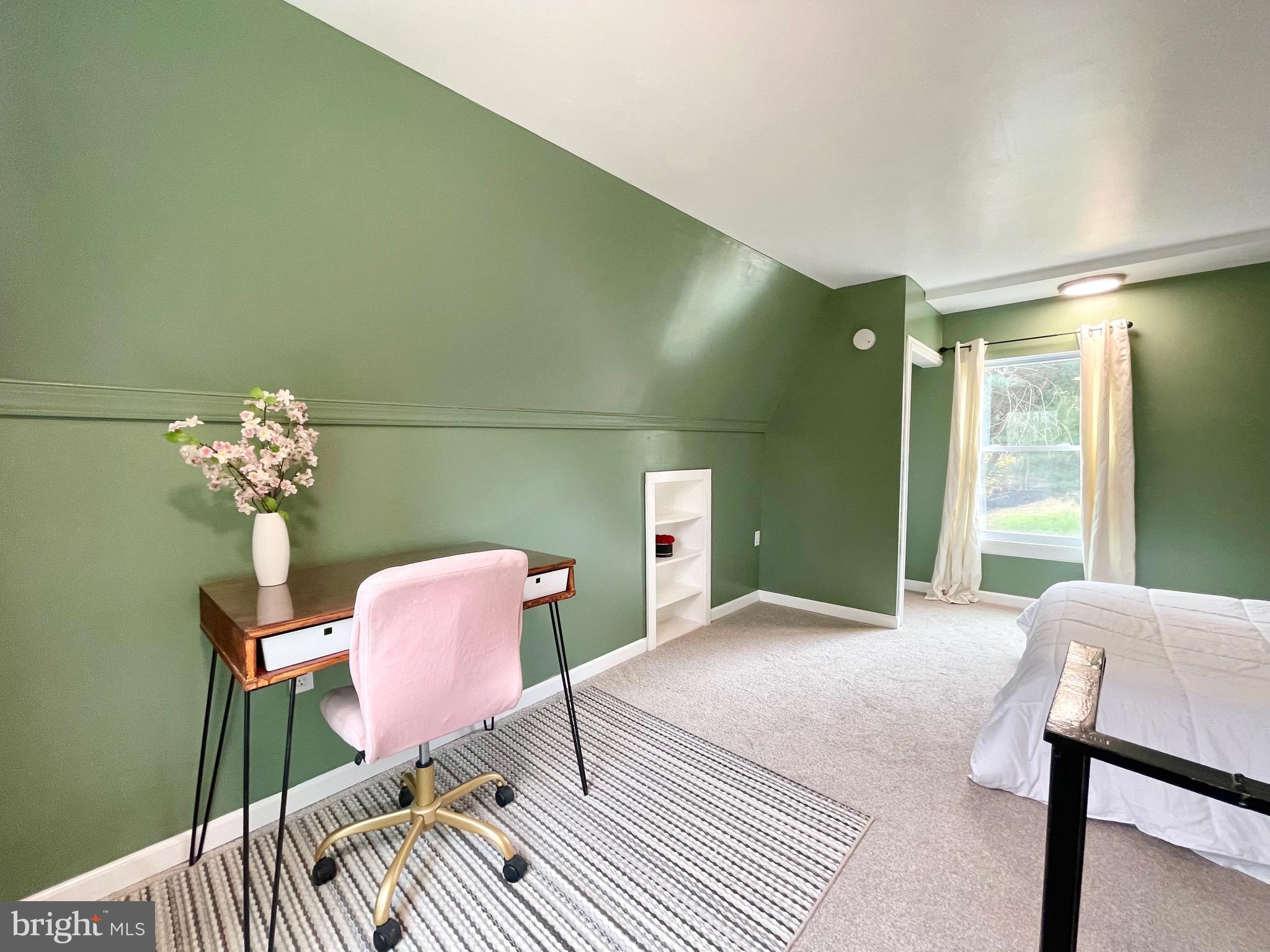 28321 Kemptown Road Damascus, MD 20872 - Photo 49 of 57 a bedroom with a bed and a chair