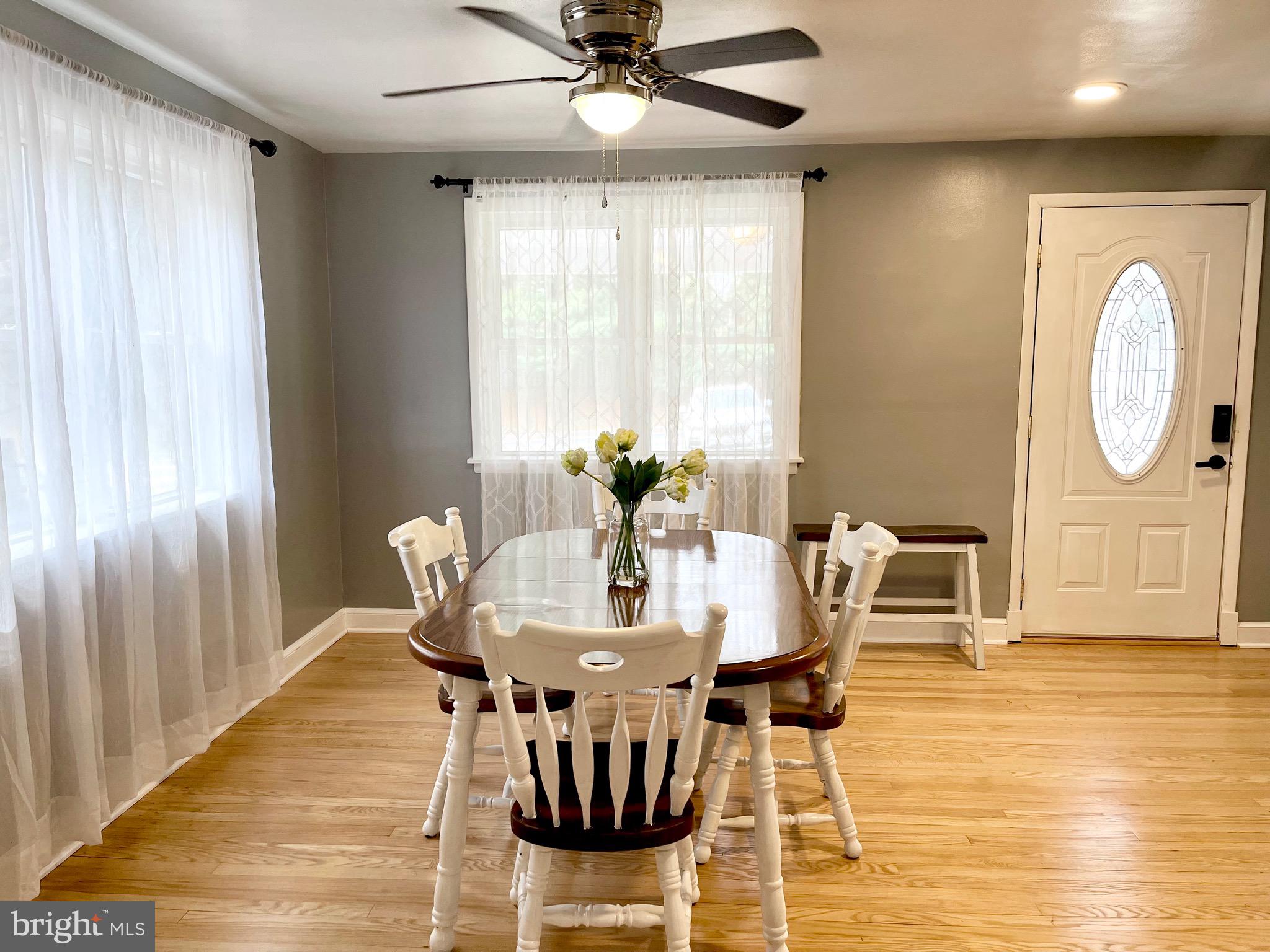 28321 Kemptown Road Damascus, MD 20872 - Photo 7 of 57 a dining room with furniture window and wooden floor