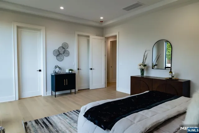 a bedroom with a bed and a table