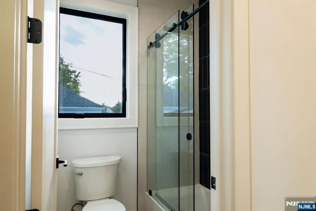 a bathroom with a double vanity sink and mirror
