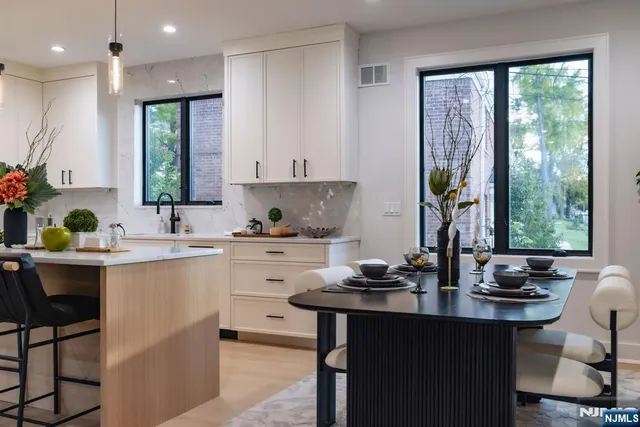 a kitchen with sink cabinets and outdoor view