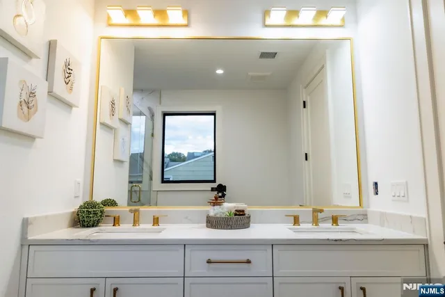 a bathroom with a bathtub and shower