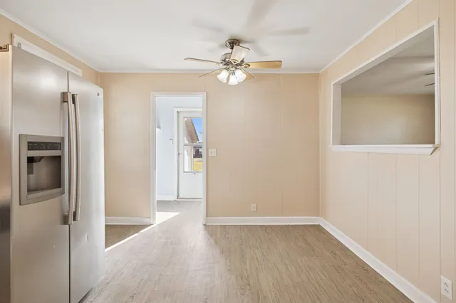 a kitchen with granite countertop white cabinets and a sink