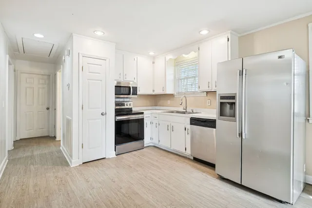 a view of an empty room with a bathroom