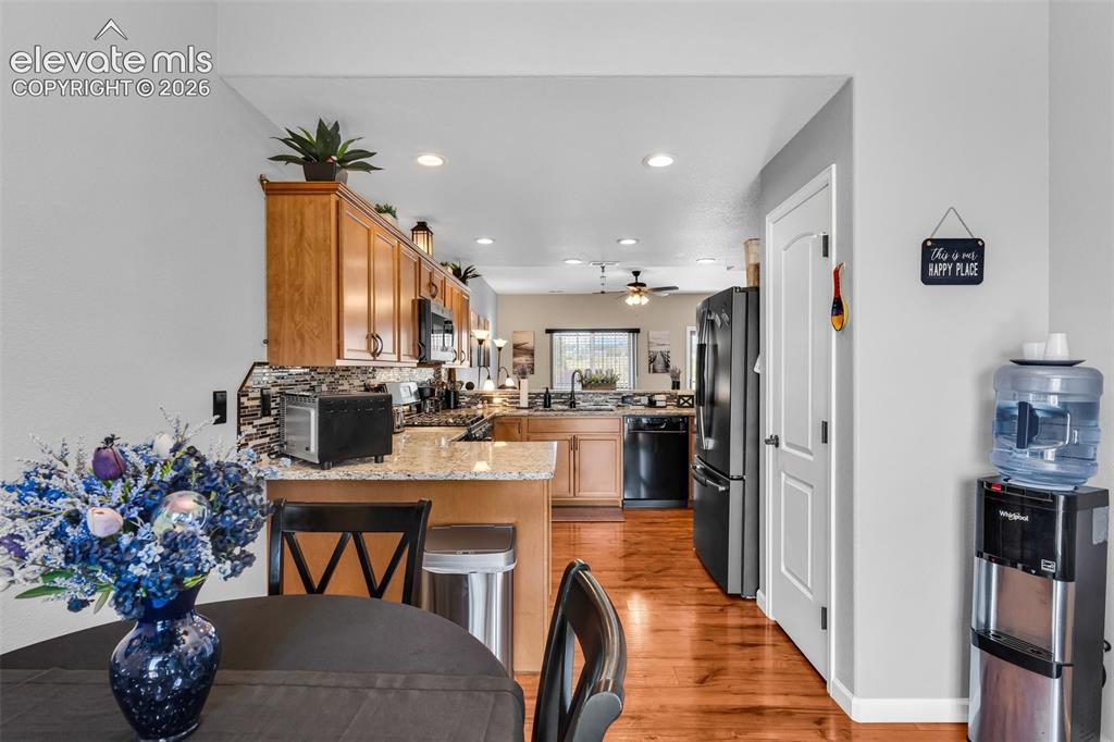 415 Empire Road Canon City, CO 81212 - Photo 18 of 40 a dining room filled chandelier and kitchen view