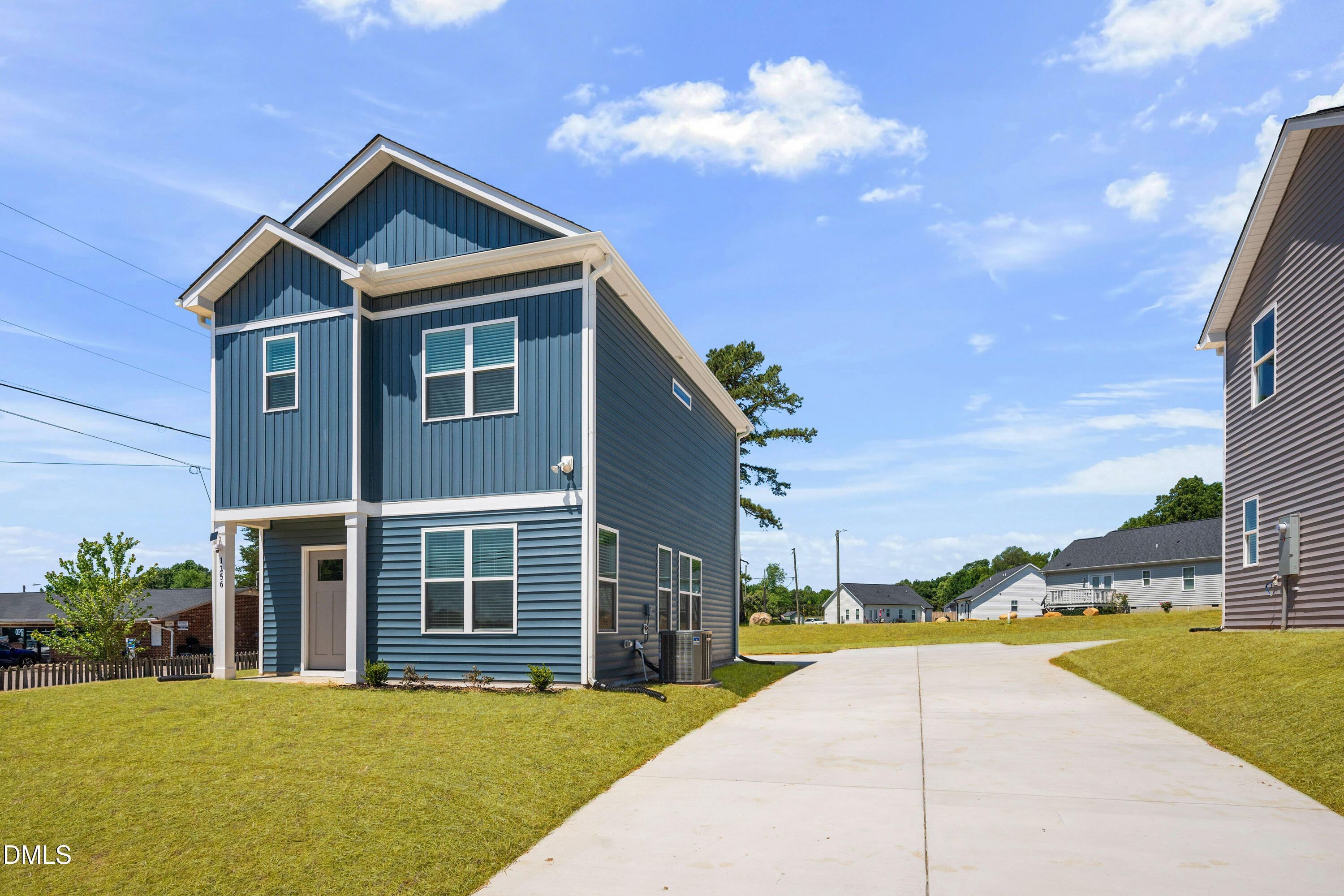 1256 Hurdle Mills Road Roxboro, NC 27573 - Photo 4 of 48 a view of a house with a swimming pool and a yard